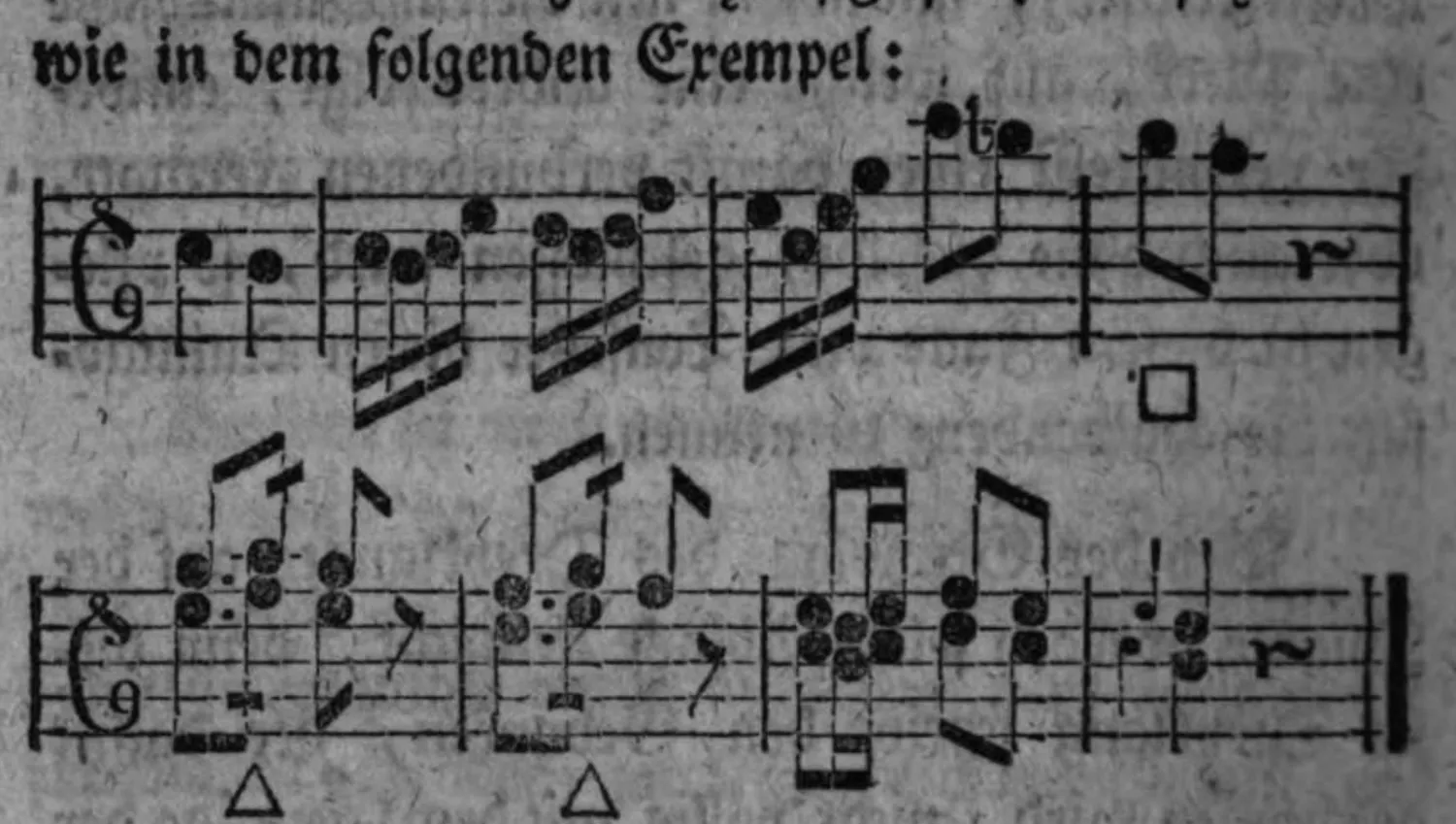 Notenbeyspiel: scheinbarer Absaz auf dem Dreyklange der Quarte mit kurzer Ausweichung, zwey Systeme, mit □ und △△