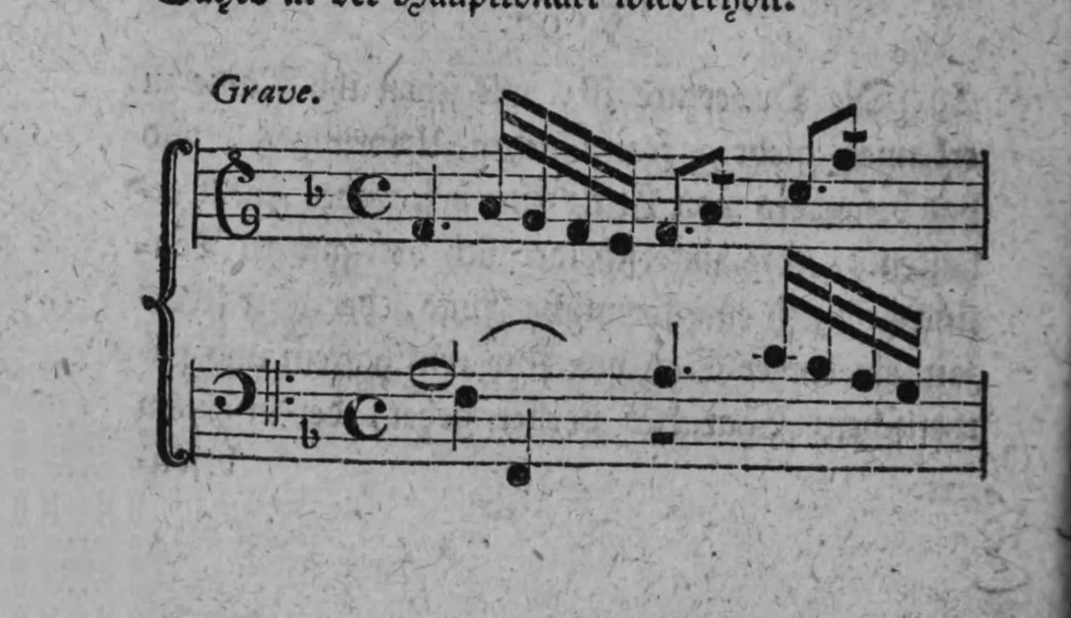 Notenbeyspiel: »Grave.«, zwey Systeme (Violinschlüssel und Baßschlüssel), punctirte Rhythmen mit geschwinden Notengruppen
